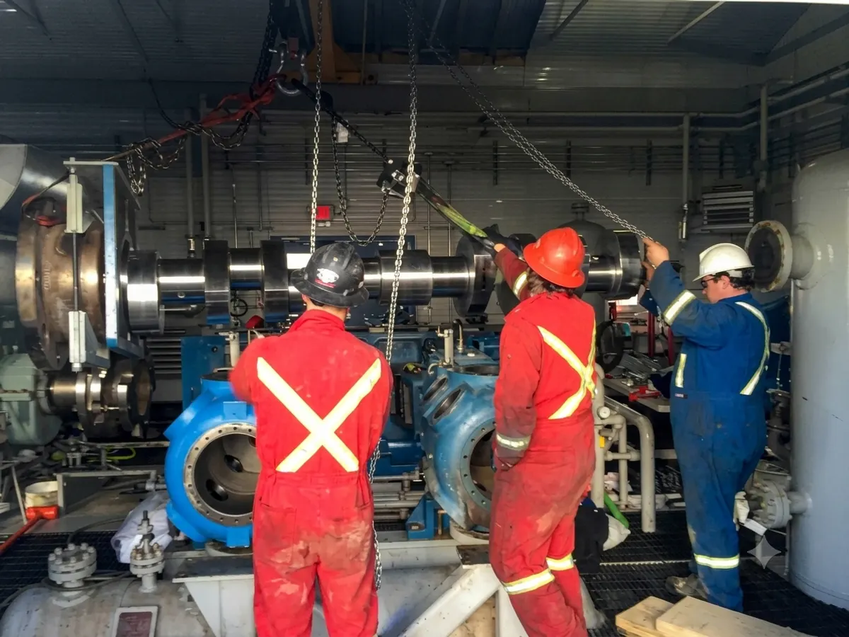Crew performing pump and coupling work